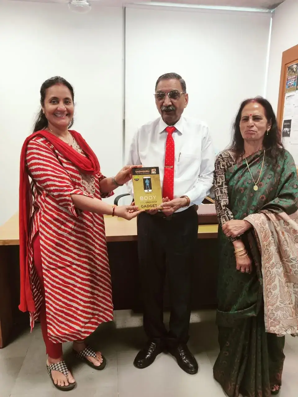 Receiving Sadguru book from teachers